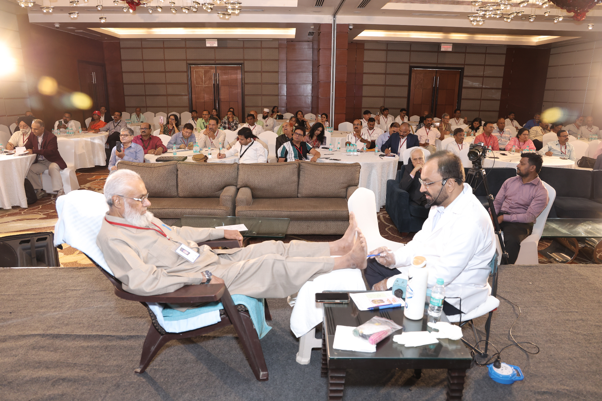 Foot reflexology live practical session before an attentive audience